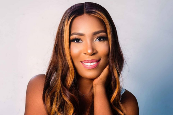 Linda Ikeji, Nigerian blogger and media entrepreneur, with her blog and media ventures in the background.